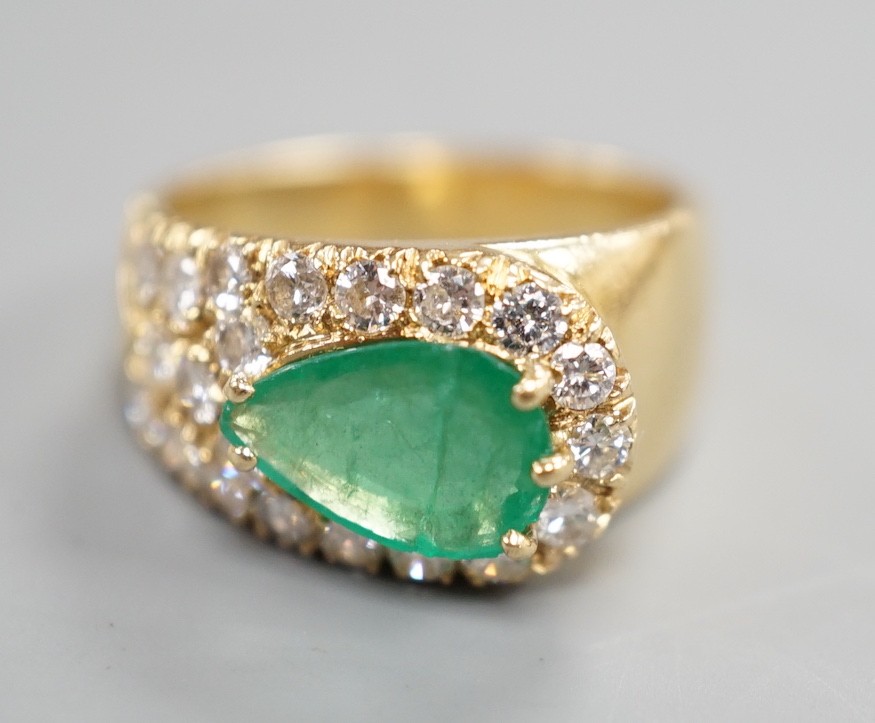 A modern yellow metal, pear cut emerald and diamond cluster set dress ring, size H, gross weight 5.1 grams.